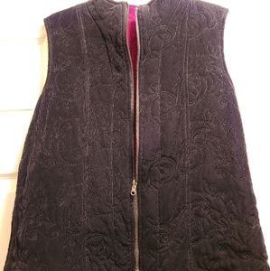 Reversable slightly quilted zippered black side and wine colored on reverse vest